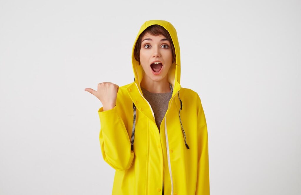 A girl in the yellow raincoat.