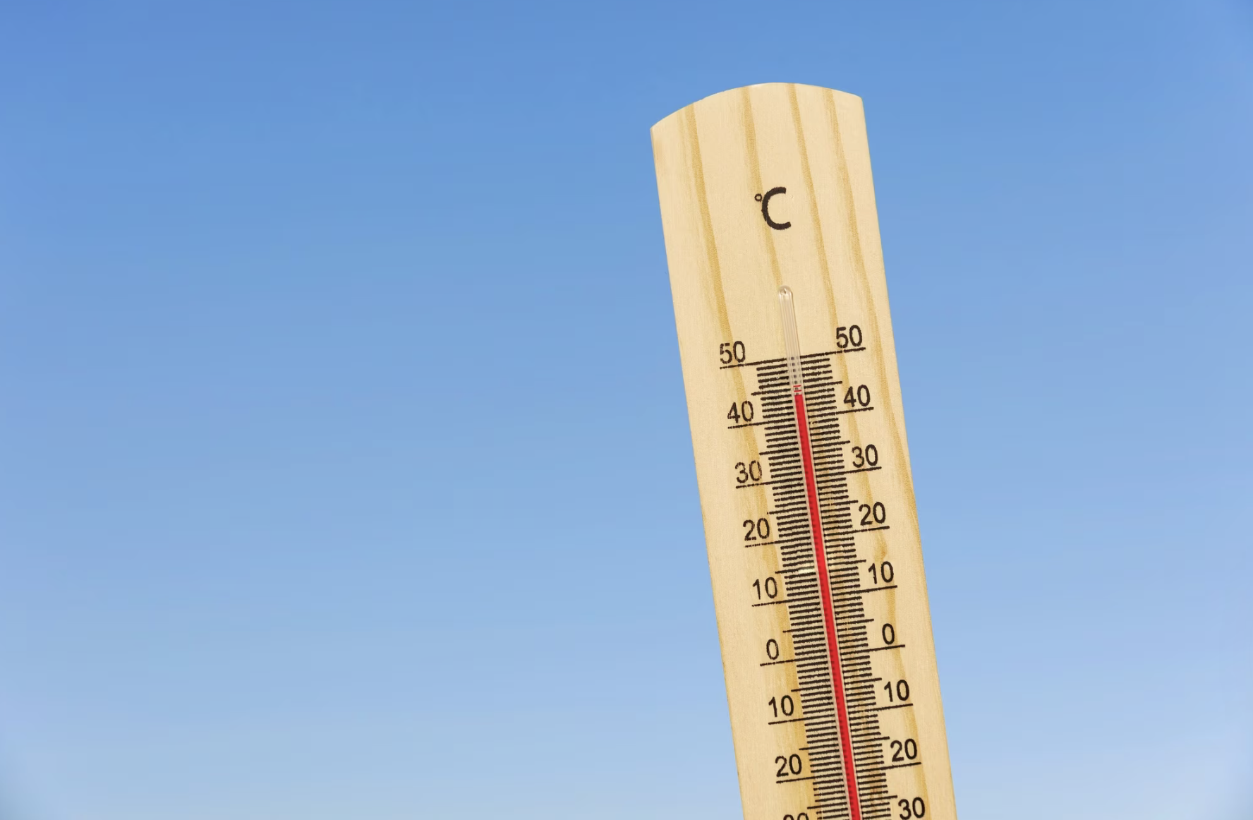 Close up on thermometer showing high temperature.