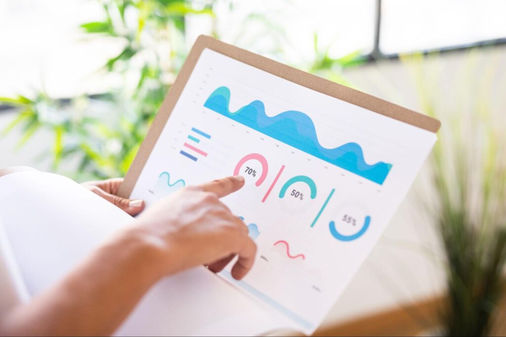 a hand pointing at an infographic with different percentage