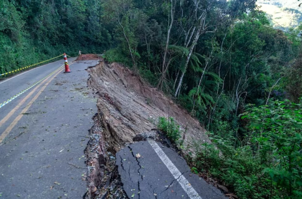 asphalt road damaged by a landslide in a mountain area