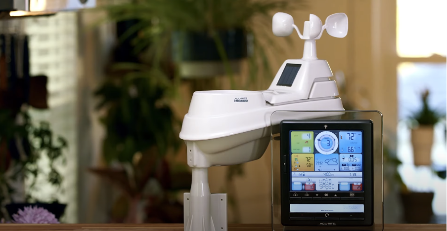 A weather station positioned on top of a table.